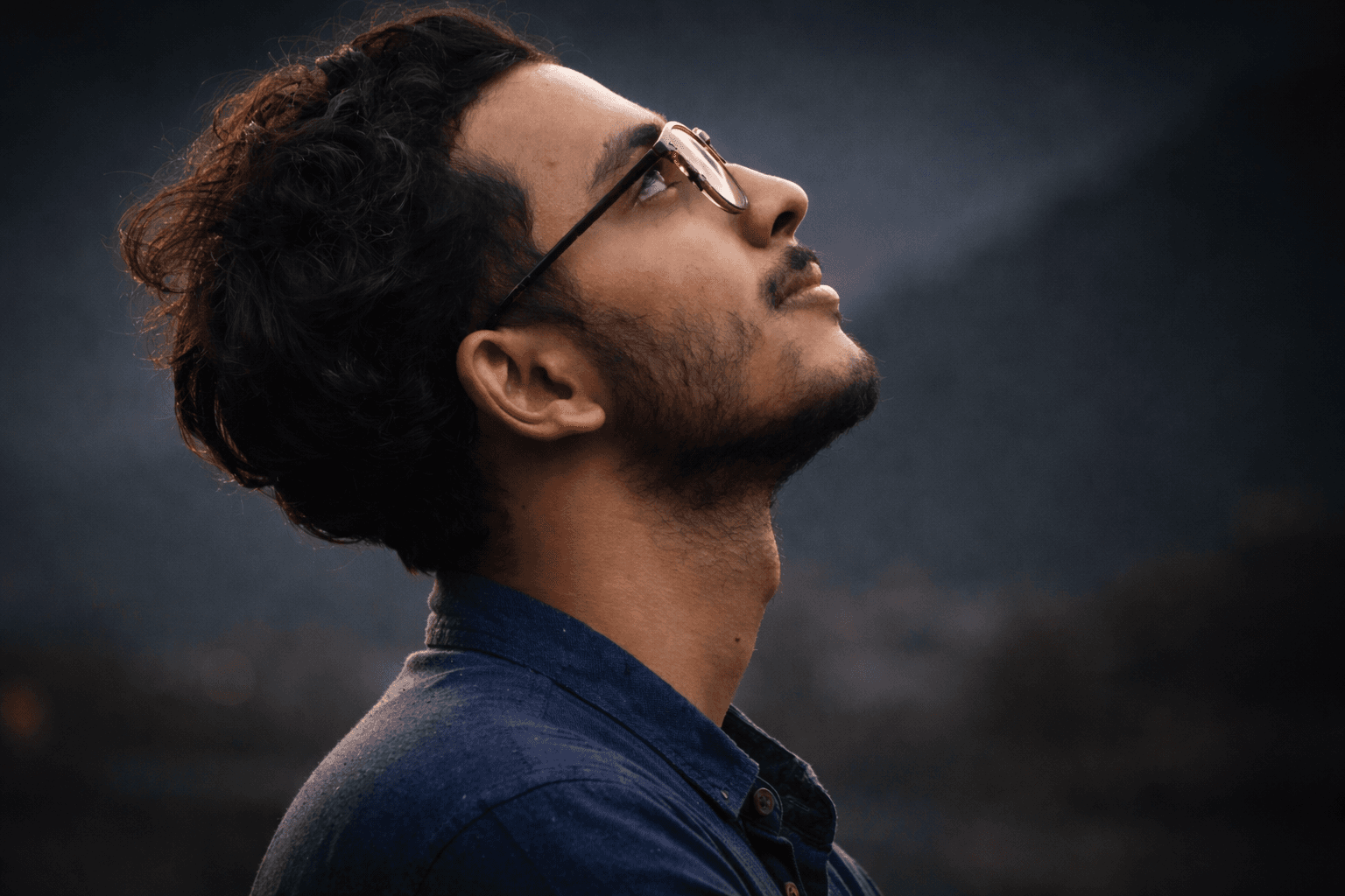 Ayush Adhikari looking up, photographed in Nepal